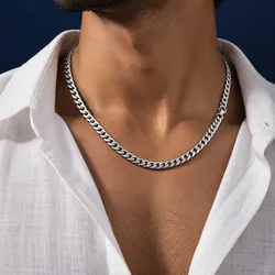 Men's silver curb chain worn with a white linen shirt